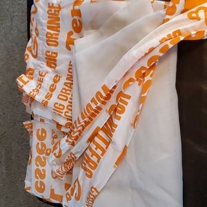 University of Tennessee curtains with white shear panel and tie backs.